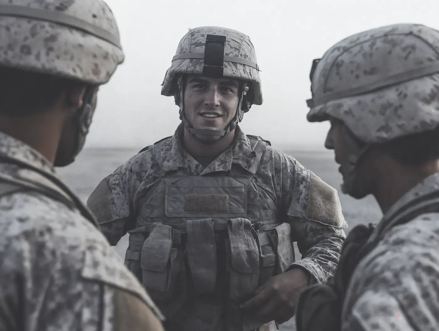 Facilitator delivering a seminar to a military unit