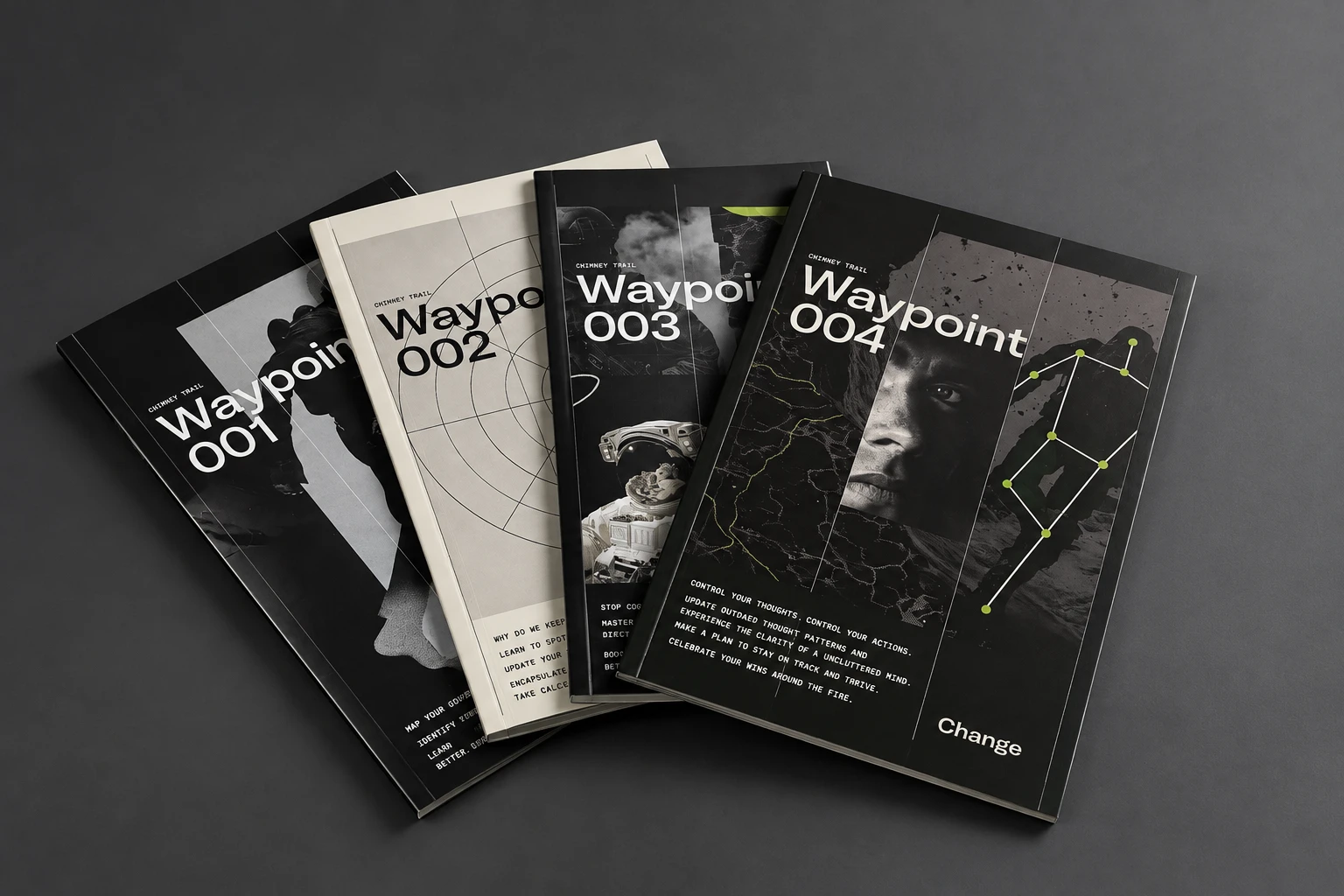 Four Chimney Trail Waypoint guidebooks, 001 through 004, fanned on a dark surface
